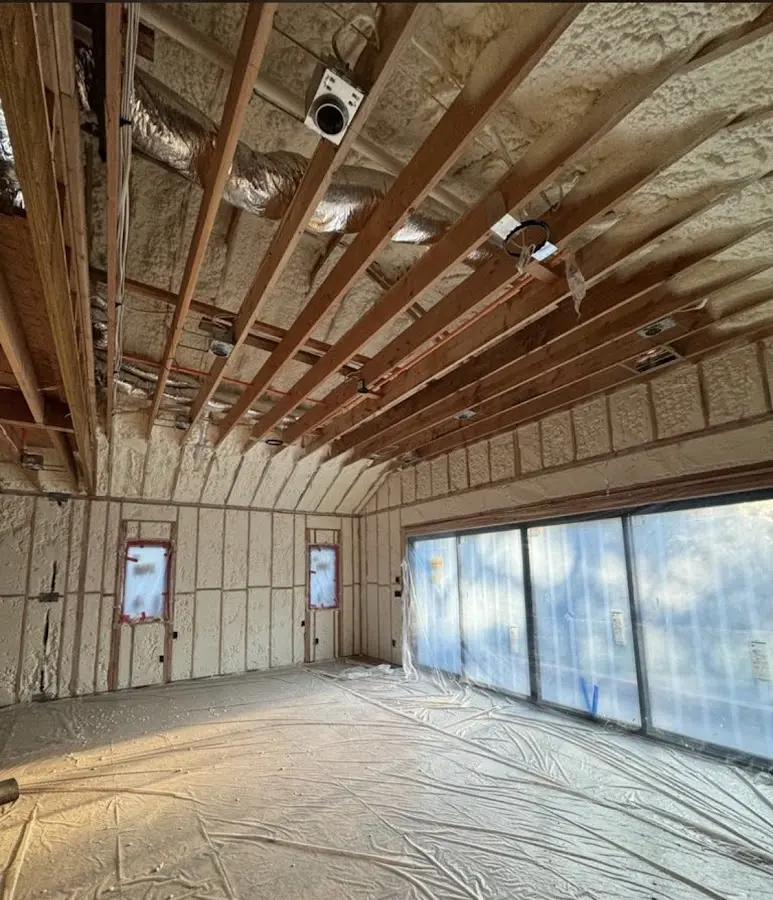 Interior walls and ceiling insulated with spray foam during new construction in Harlingen